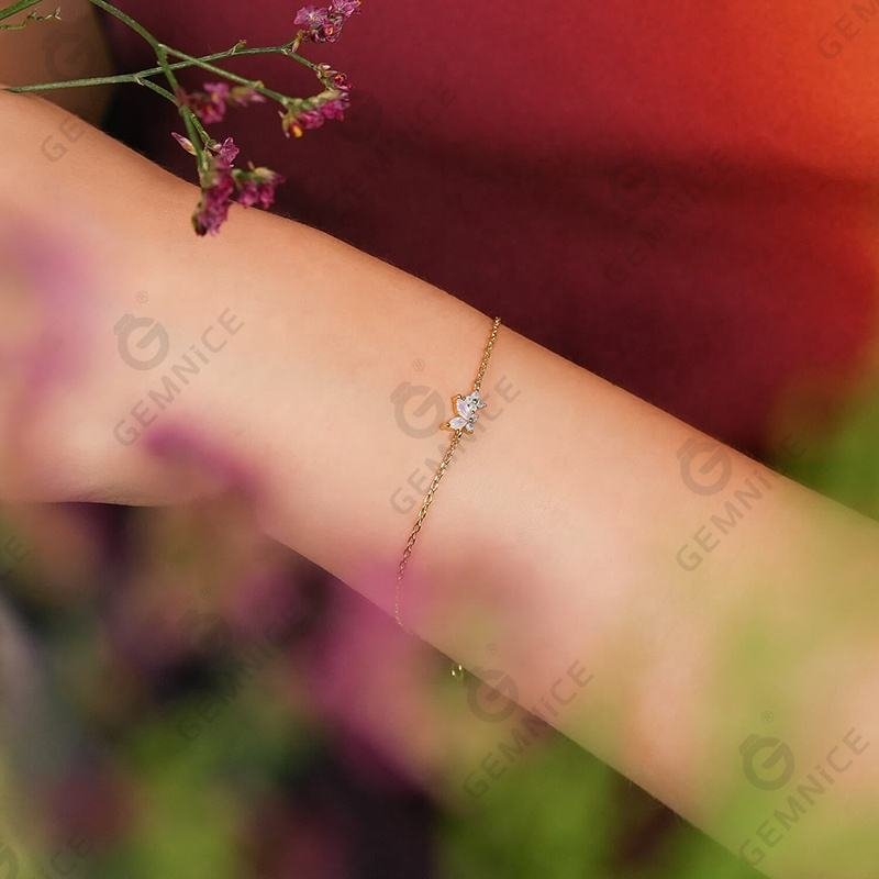 Second image of Pastel Butterfly & Flower Gold Bracelet