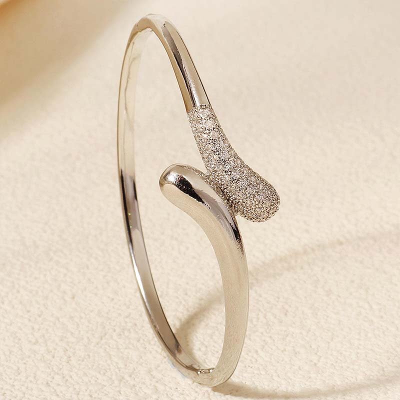 Second image of minimalist silver-plated zircon open bangle