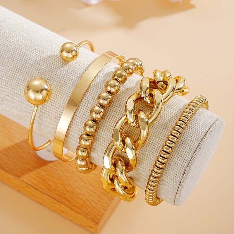 Second image of gold multi-texture stackable jewelry set