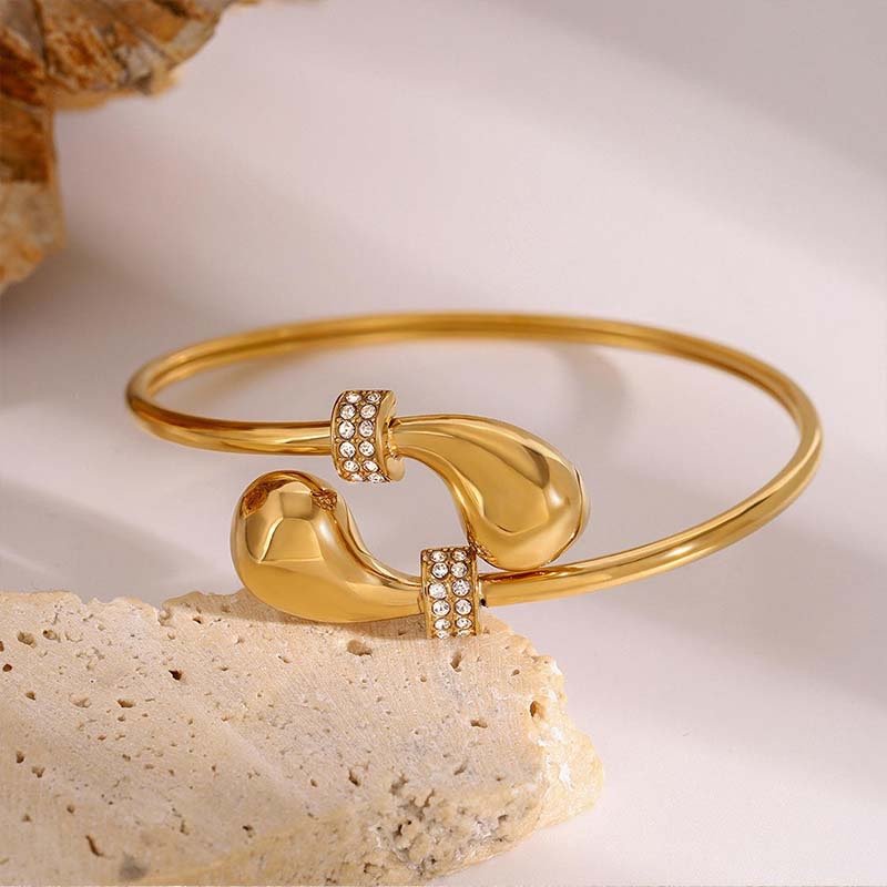 Second image of stainless steel gold-plated teardrop diamond-embellished open bangle